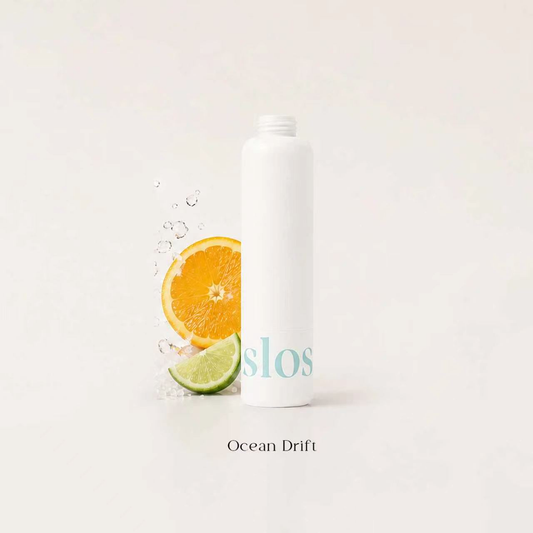 White fragrance filter cartridge with orange slice and lime with water splash